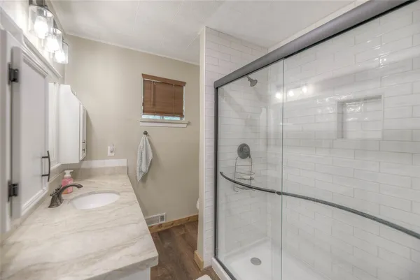 a kitchen with stainless steel appliances granite countertop counter space a sink and cabinets