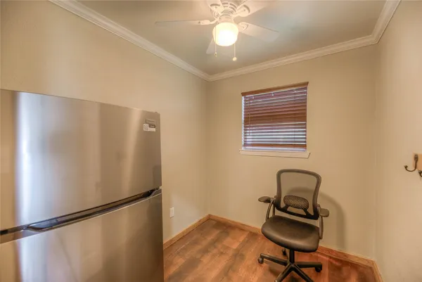 a bathroom with a granite countertop sink a mirror and shower