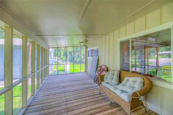 a view of a house with a yard and sitting area