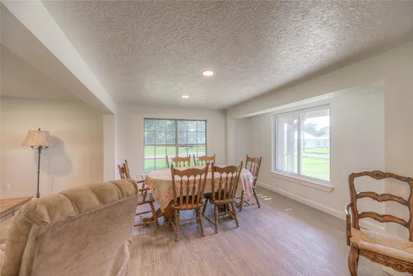 a room with a refrigerator and a sink