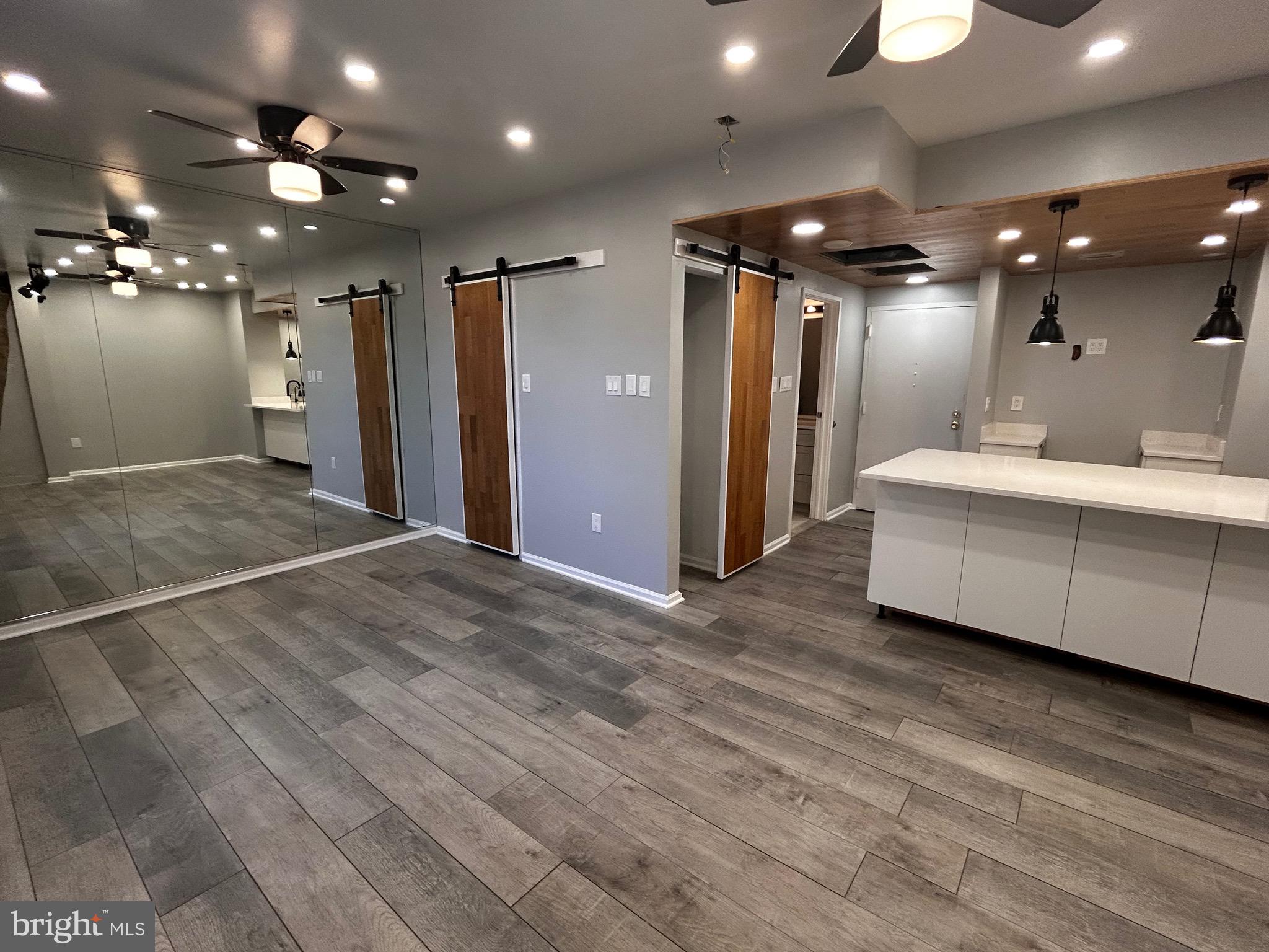 1601 Spring Garden Street, Unit 502 Philadelphia, PA 19130 - Photo 6 of 18 a view of a big room with closet and a chandelier