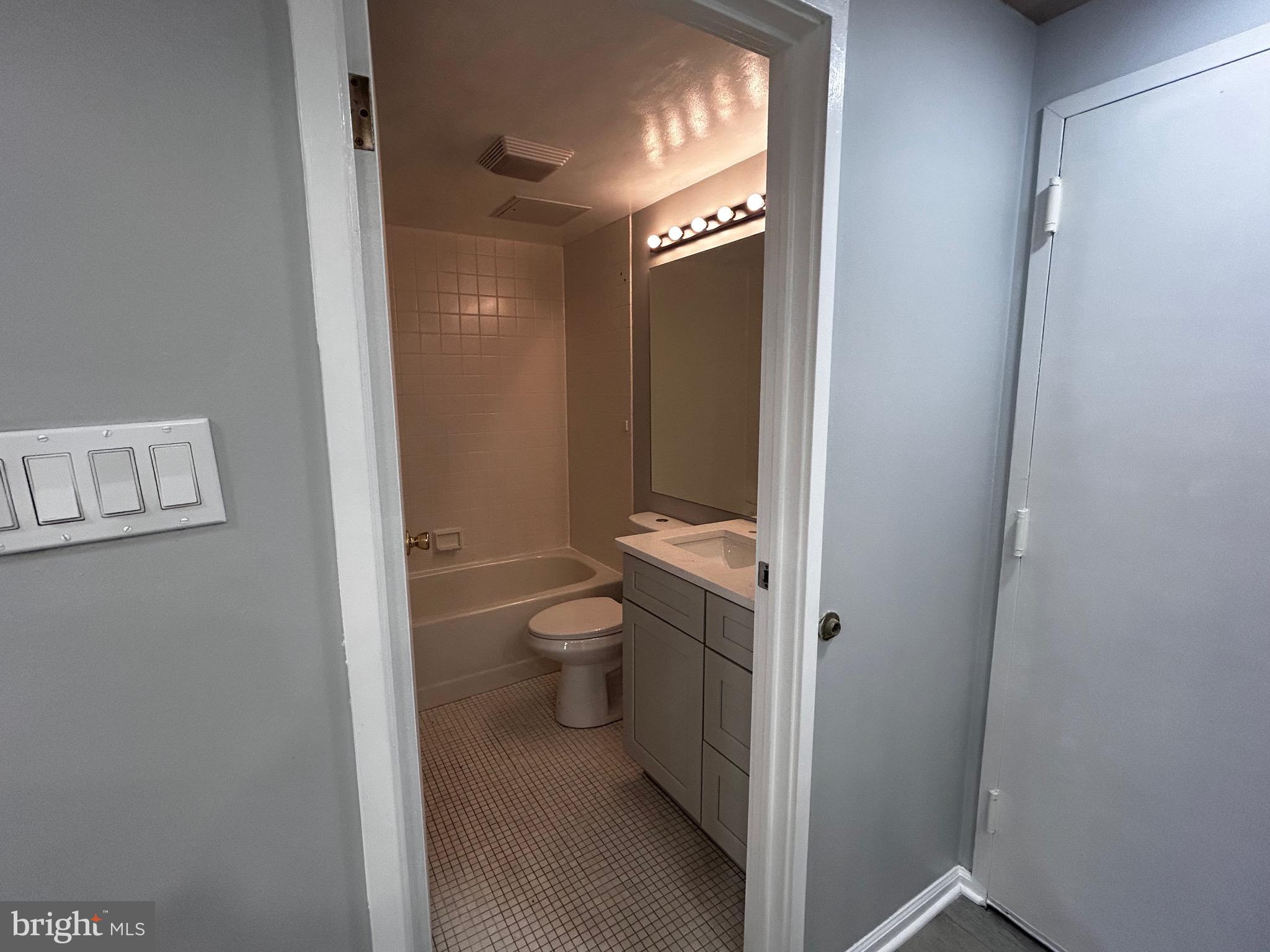 1601 Spring Garden Street, Unit 502 Philadelphia, PA 19130 - Photo 10 of 18 a view of a bathroom with a sink and toilet