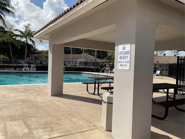 a view of living room kitchen and patio