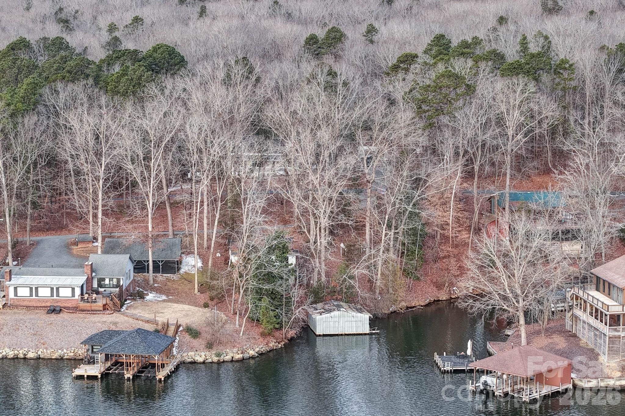 an aerial view of a house with yard swimming pool and outdoor seating