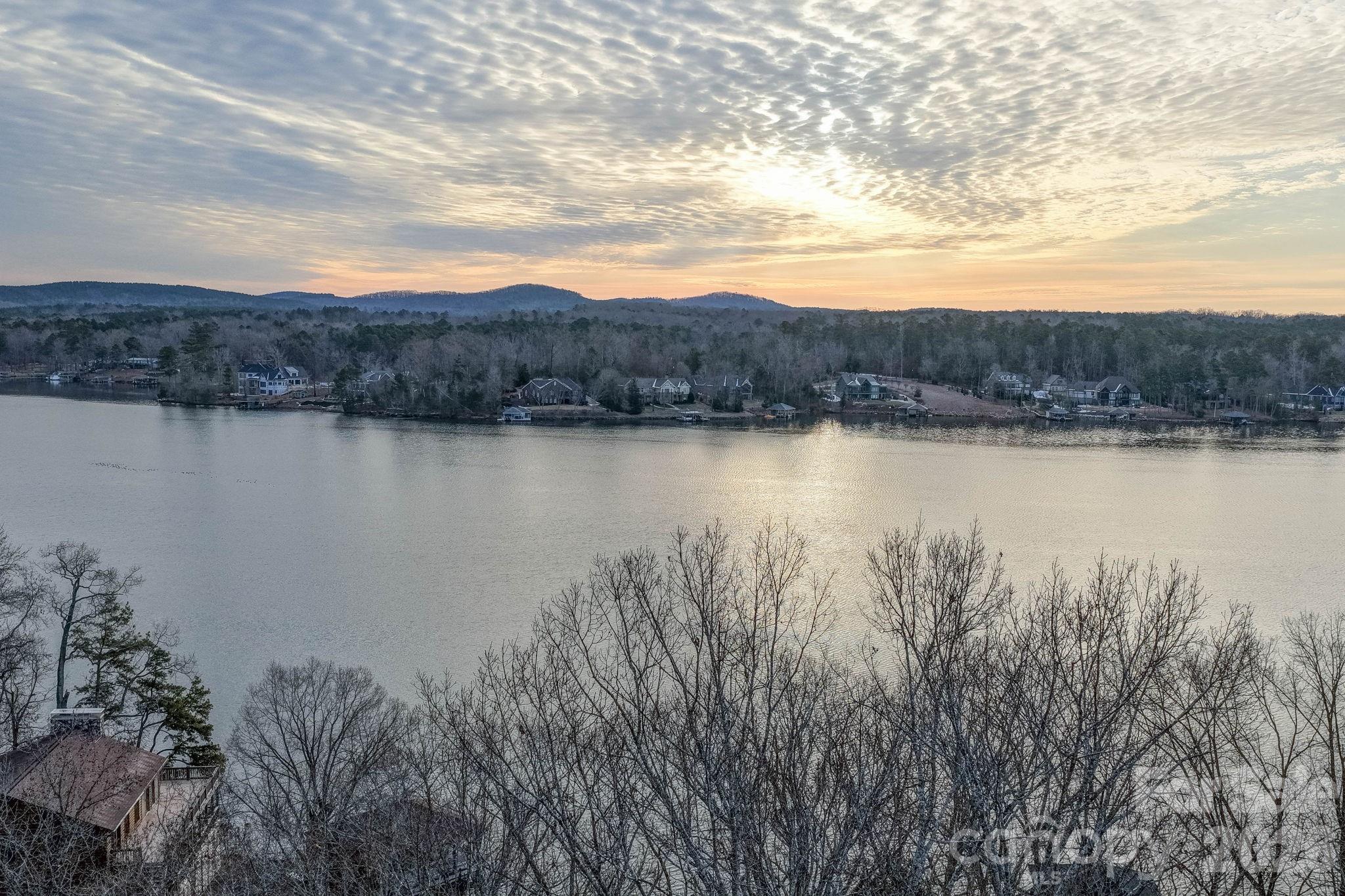 49611 Waterview Trail Albemarle, NC 28001 - Photo 13 of 22 a view of a lake with a mountain in the background
