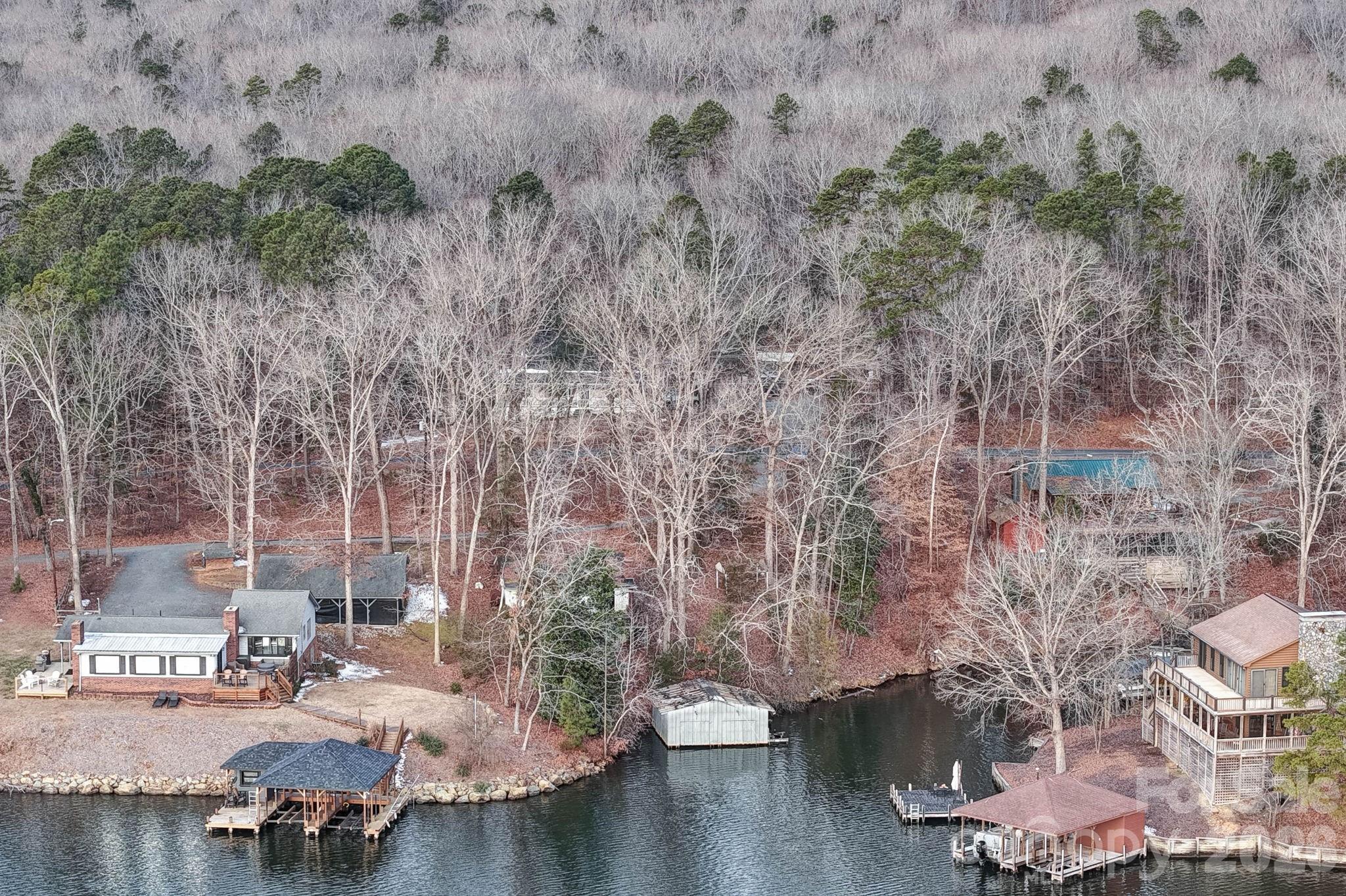 49611 Waterview Trail Albemarle, NC 28001 - Photo 6 of 22 a view of a lake with houses