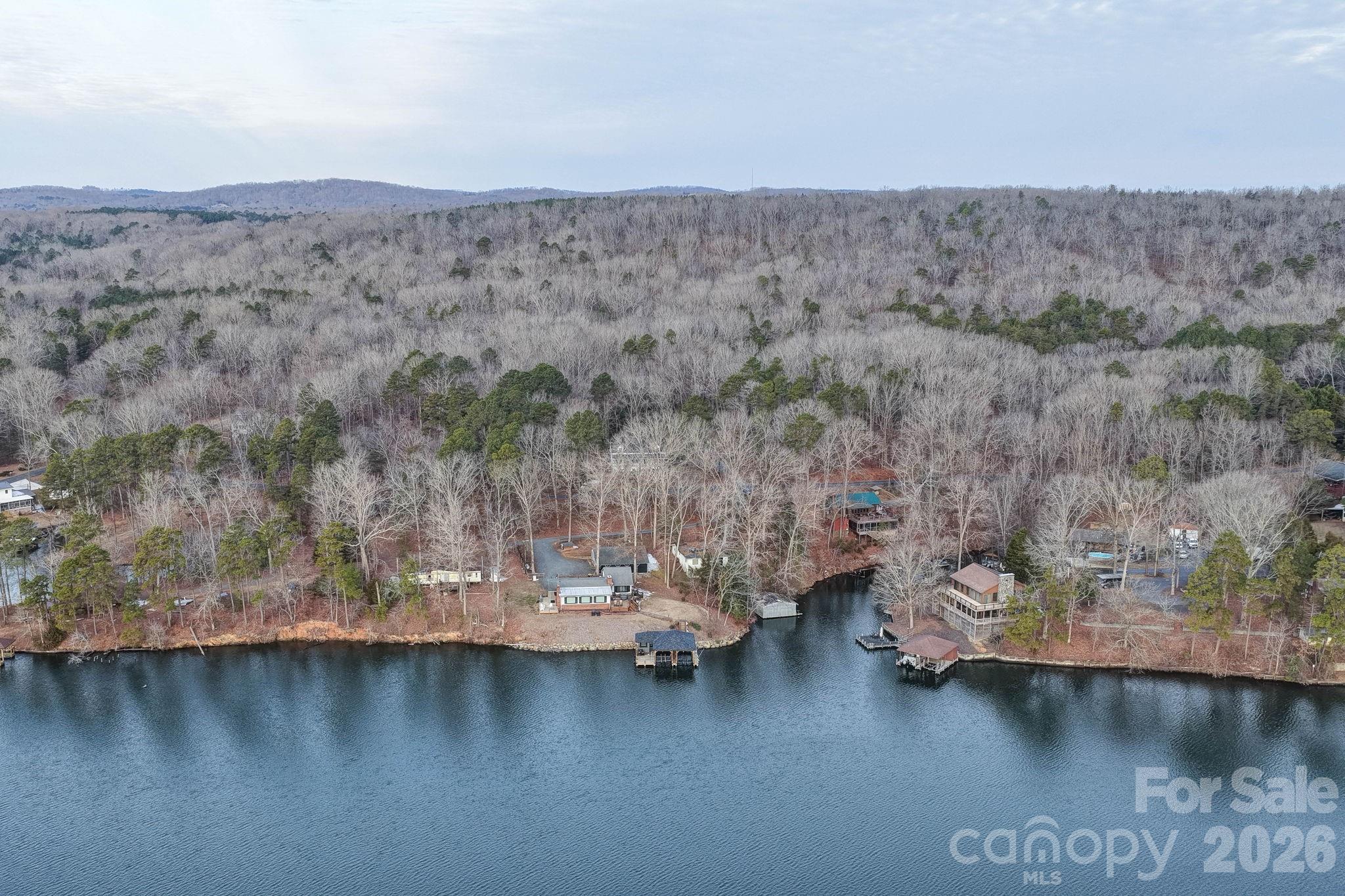 49611 Waterview Trail Albemarle, NC 28001 - Photo 9 of 22 a view of a lake with mountain in the background