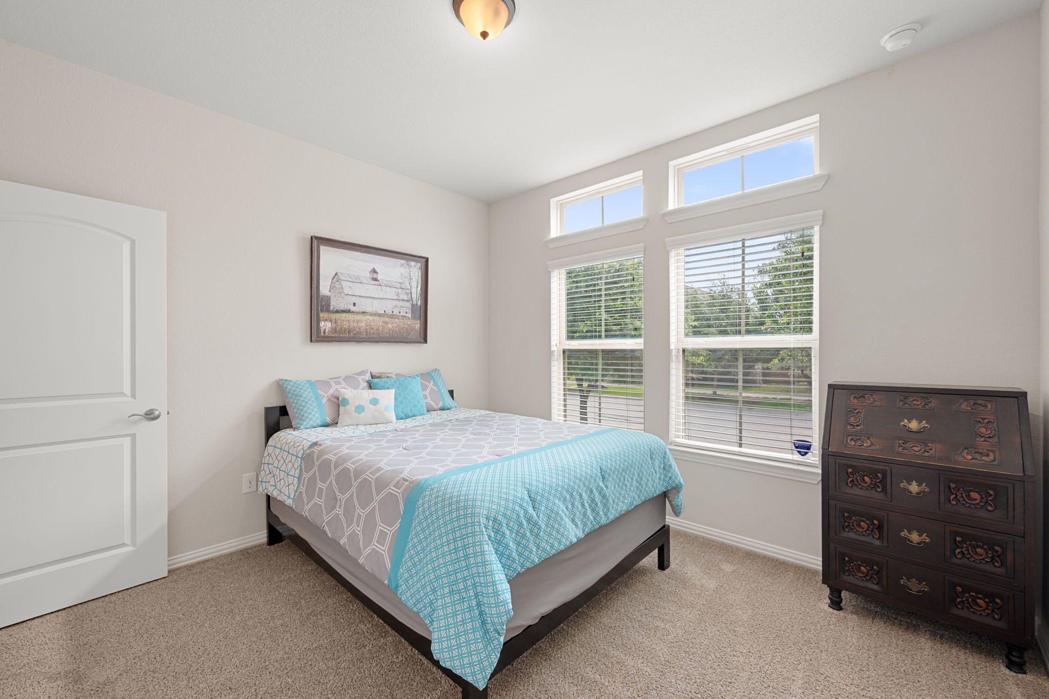 8800 Slater Drive Austin, TX 78747 - Photo 22 of 40 a bedroom with a bed and a window
