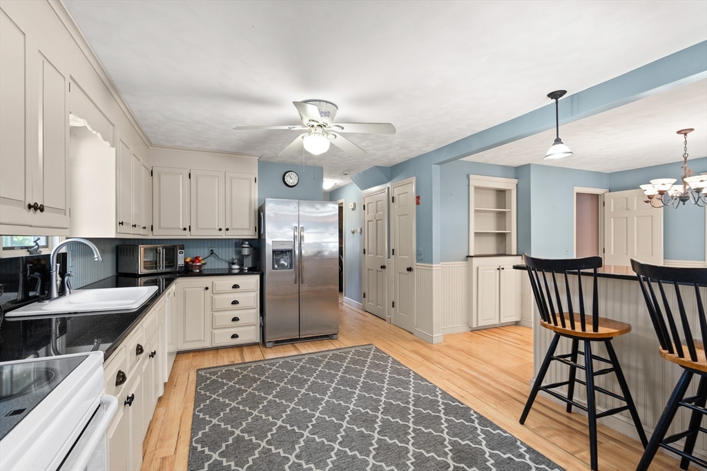 63 Pomeroy Street Easthampton, MA 01027 - Photo 12 of 42 a kitchen with stainless steel appliances granite countertop a sink and a refrigerator