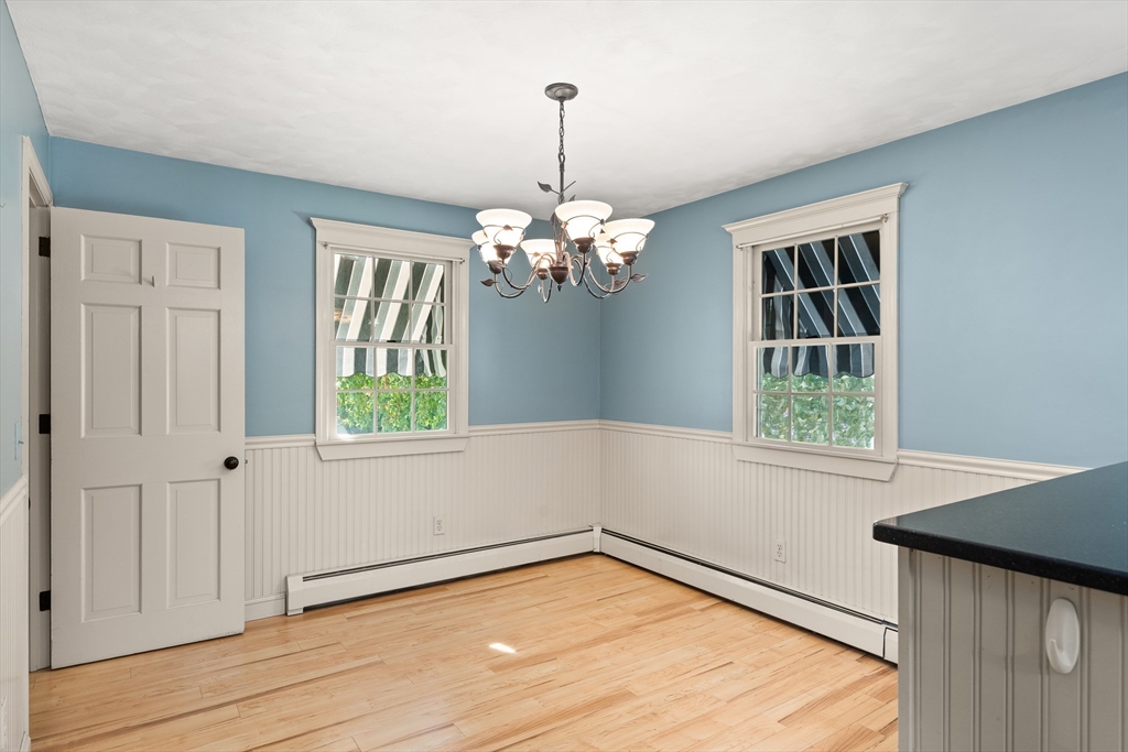 63 Pomeroy Street Easthampton, MA 01027 - Photo 18 of 42 wooden floor in an empty room with a window