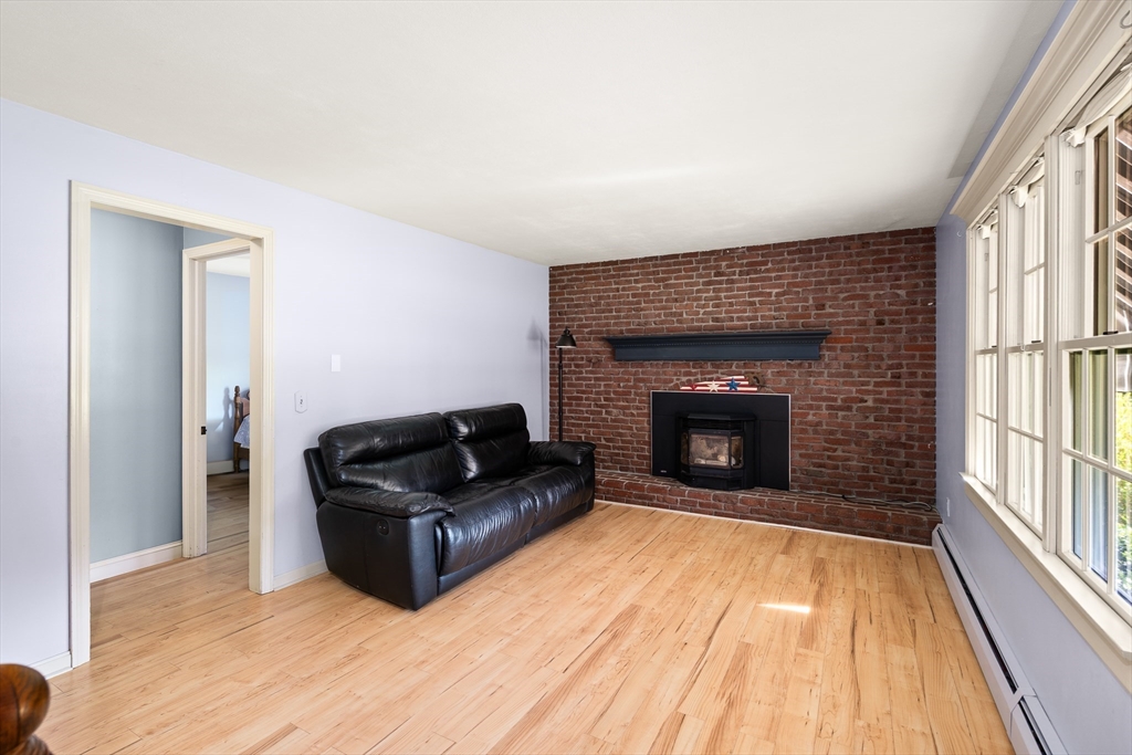 63 Pomeroy Street Easthampton, MA 01027 - Photo 21 of 42 a living room with furniture and a fireplace