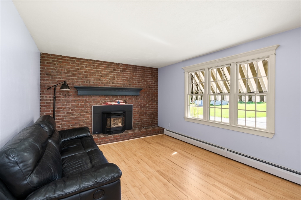 63 Pomeroy Street Easthampton, MA 01027 - Photo 22 of 42 a living room with furniture and a fireplace