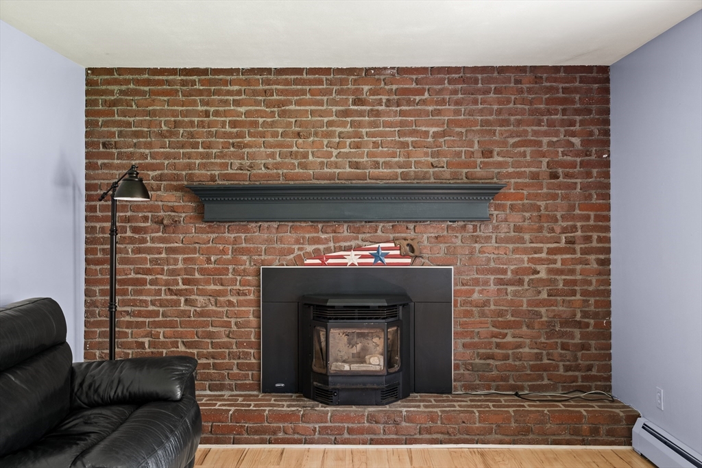 63 Pomeroy Street Easthampton, MA 01027 - Photo 23 of 42 a brick oven with a fireplace