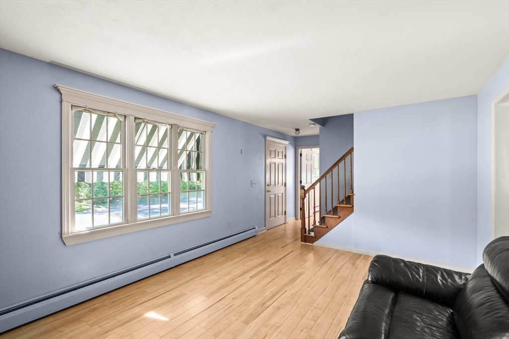 63 Pomeroy Street Easthampton, MA 01027 - Photo 25 of 42 a view of an empty room with wooden floor and a window