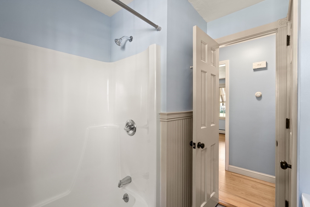 63 Pomeroy Street Easthampton, MA 01027 - Photo 30 of 42 a bathroom with a glass shower door