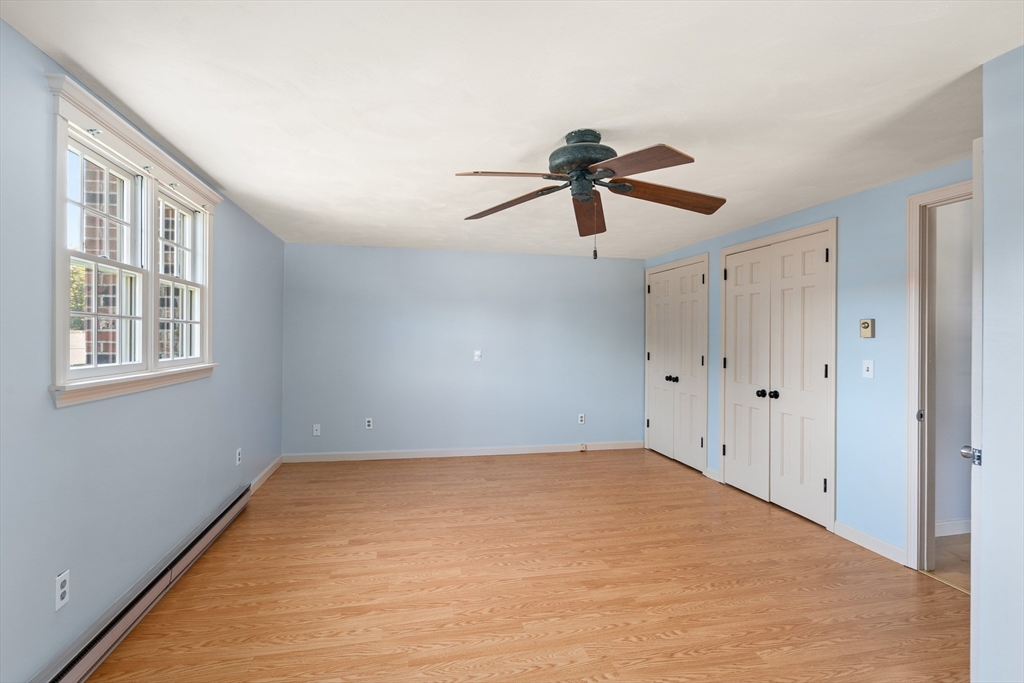 63 Pomeroy Street Easthampton, MA 01027 - Photo 33 of 42 a view of a big room with carpet and a chandelier fan