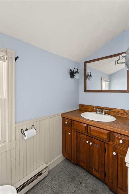 63 Pomeroy Street Easthampton, MA 01027 - Photo 35 of 42 a bathroom with a granite countertop sink and a mirror