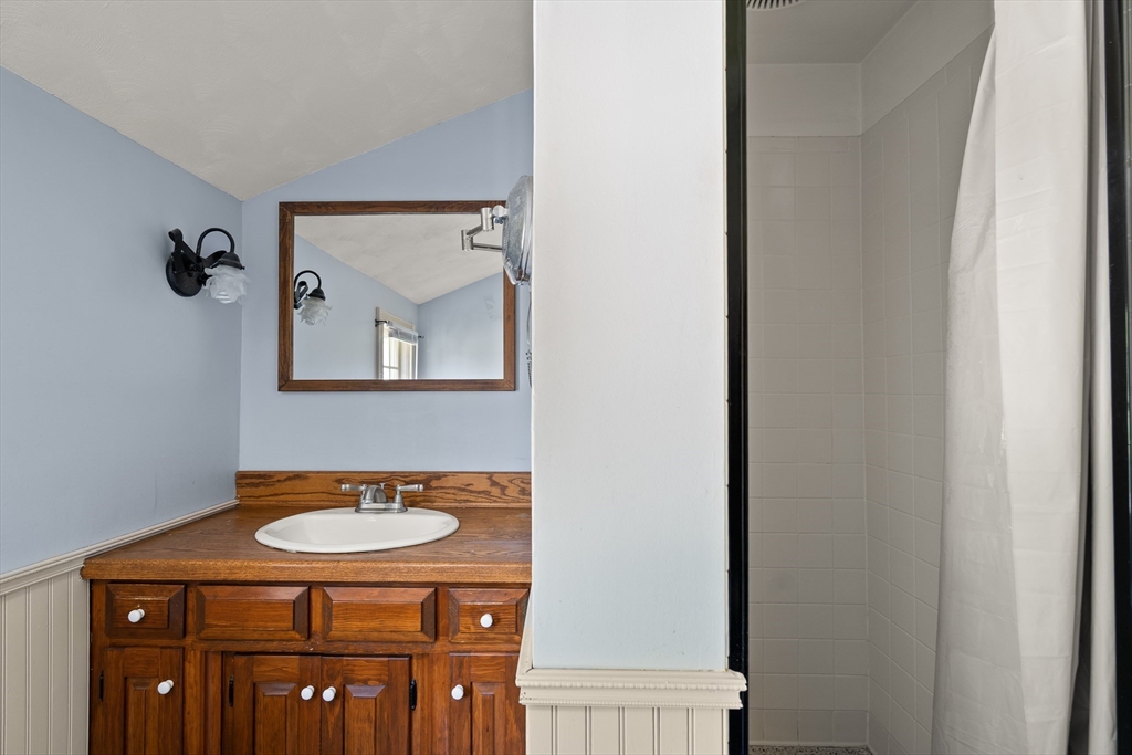 63 Pomeroy Street Easthampton, MA 01027 - Photo 36 of 42 a bathroom with a sink a mirror and a toilet