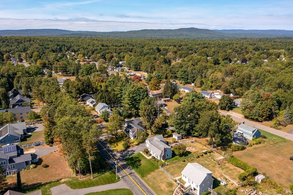 63 Pomeroy Street Easthampton, MA 01027 - Photo 4 of 42 an aerial view of residential houses with outdoor space and trees