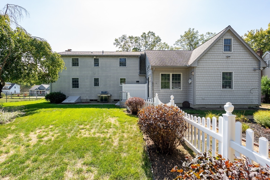 63 Pomeroy Street Easthampton, MA 01027 - Photo 5 of 42 a front view of house with yard and trees in the background