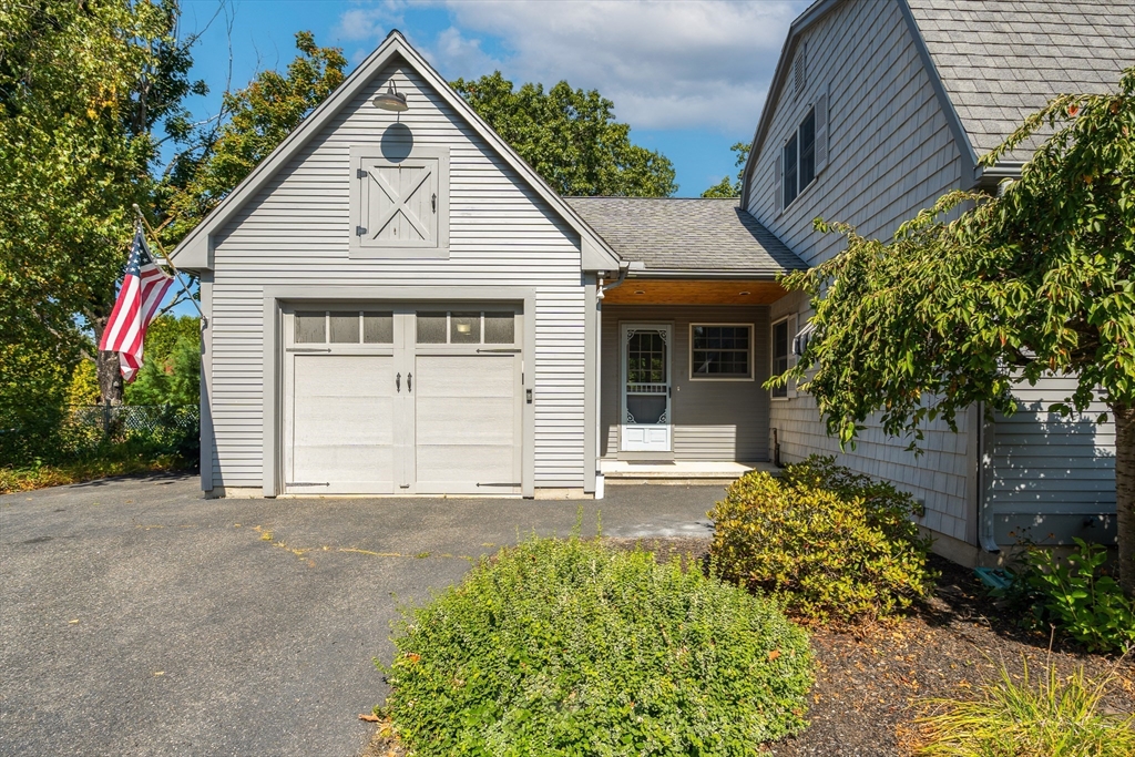 63 Pomeroy Street Easthampton, MA 01027 - Photo 6 of 42 a view of a house with a yard and potted plants