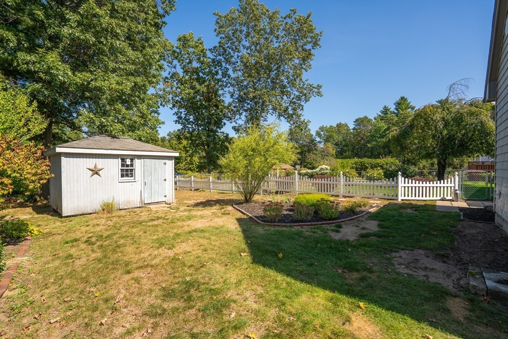 63 Pomeroy Street Easthampton, MA 01027 - Photo 10 of 42 a view of a house with backyard and sitting area
