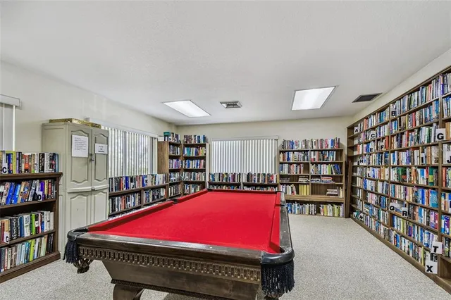 a room with furniture and book shelf