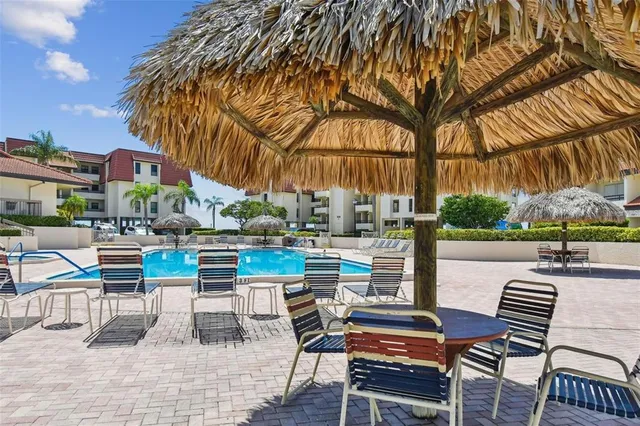 a view of chairs and tables in the patio