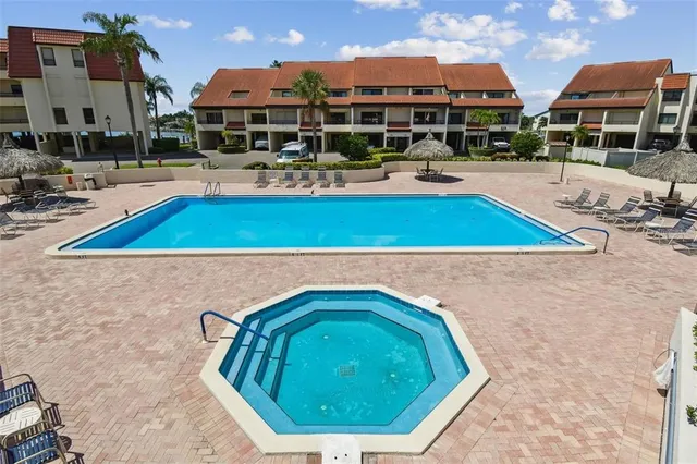 an aerial view of a house with swimming pool