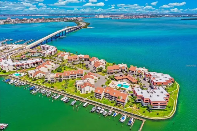 a wooden floor with swimming pool and lake view