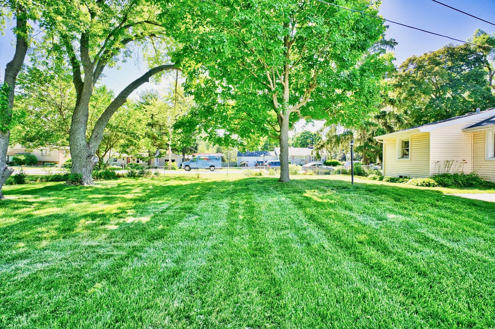 705 Carlisle Road Batavia, IL 60510 - Photo 23 of 25 a backyard of a house with lots of green space and garden view