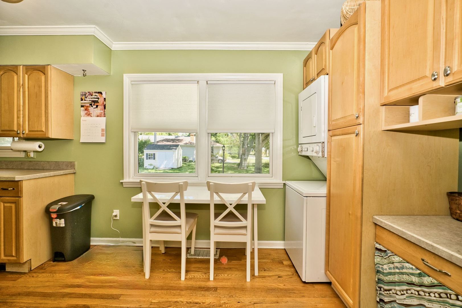 705 Carlisle Road Batavia, IL 60510 - Photo 8 of 25 a dining room with a window and wooden floor