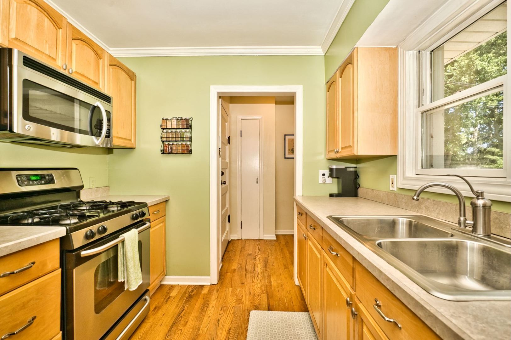 705 Carlisle Road Batavia, IL 60510 - Photo 10 of 25 a kitchen with stainless steel appliances a stove a sink and a microwave