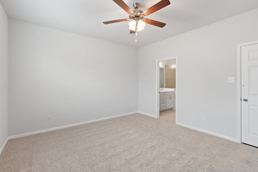 457 Elephant Island Loop Kyle, TX 78640 - Photo 13 of 30 a view of an empty room and chandelier fan