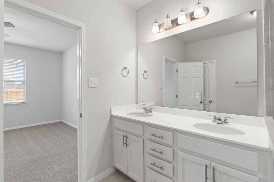457 Elephant Island Loop Kyle, TX 78640 - Photo 14 of 30 a bathroom with a sink double vanity and a mirror