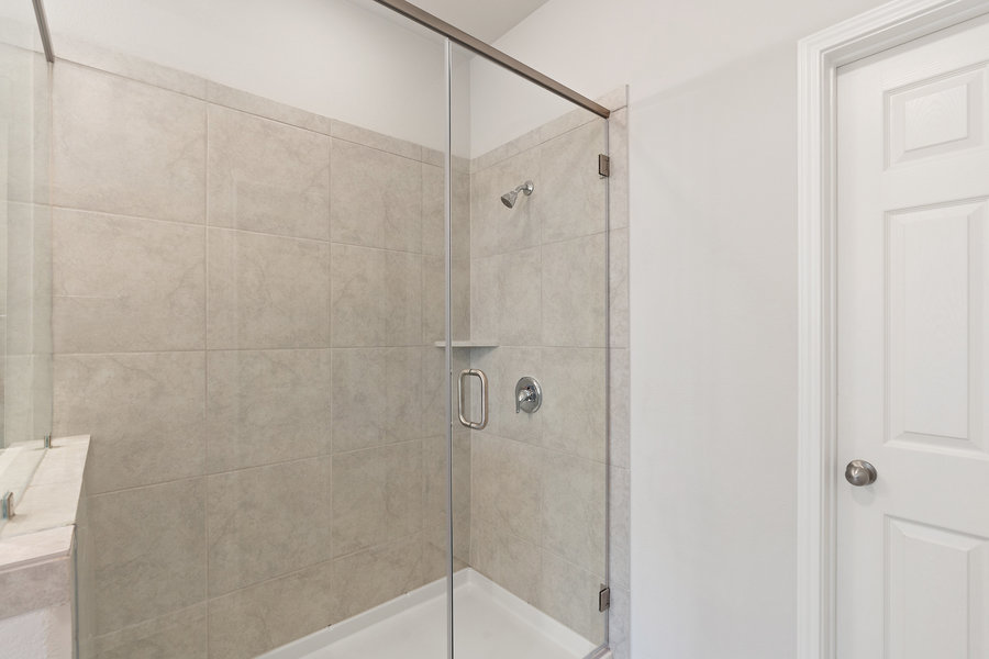 457 Elephant Island Loop Kyle, TX 78640 - Photo 17 of 30 a bathroom with a shower