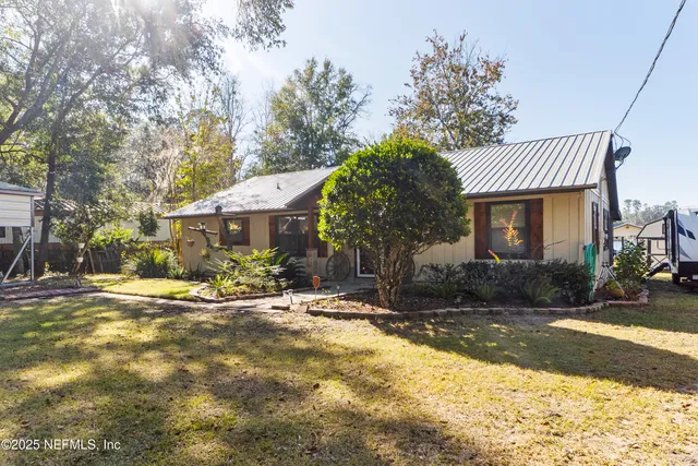 a kitchen with stainless steel appliances granite countertop a refrigerator stove and sink