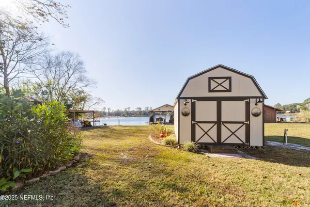 a kitchen with stainless steel appliances kitchen island granite countertop a sink and cabinets