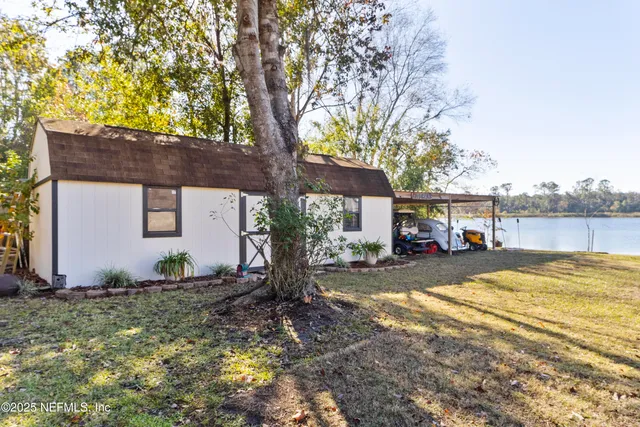 a living room with furniture fireplace and a window