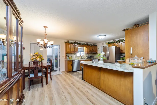 a living room with furniture fireplace and a window