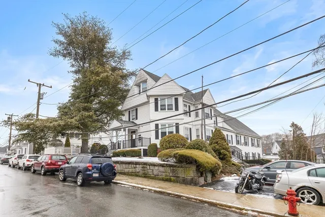 a view of a street with cars