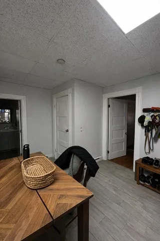 a bedroom with furniture and a wooden floor