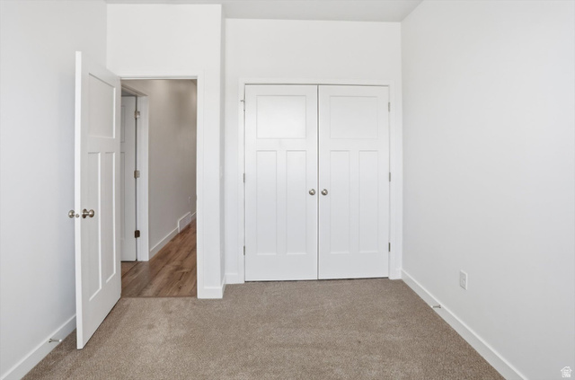 3636 West 910 South Syracuse, UT 84075 - Photo 29 of 70 Neutral-toned carpeting paired with crisp white walls