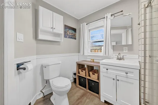 a bathroom with a sink a toilet and vanity