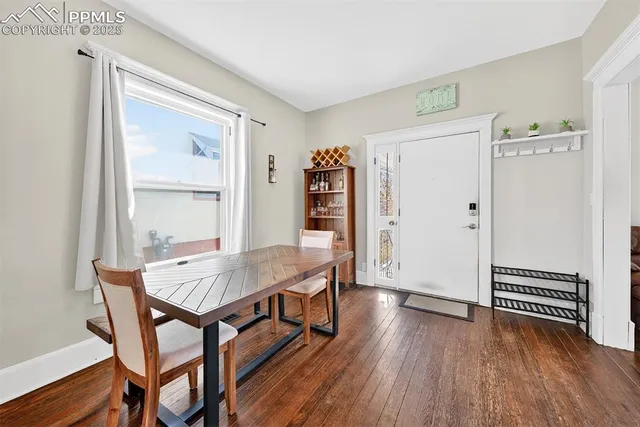 a view of a livingroom with furniture and wooden floor