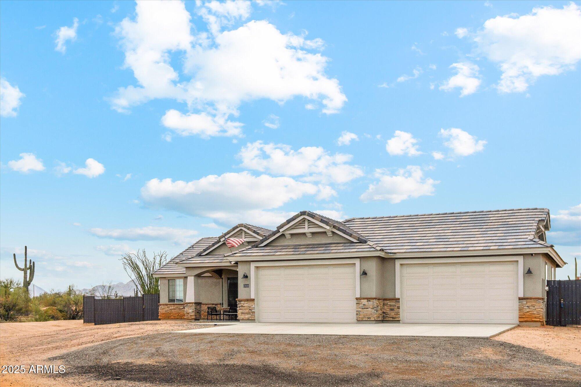 27420 North 170th Street Rio Verde, AZ 85263 - Photo 1 of 39 a view of a big house with a big yard and large tree