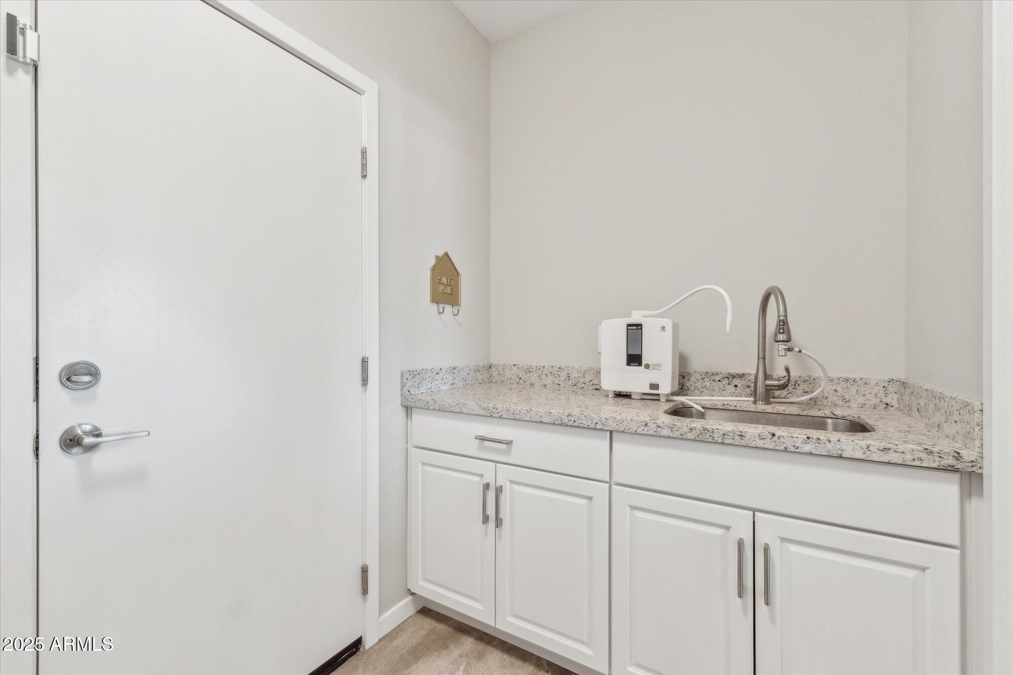 27420 North 170th Street Rio Verde, AZ 85263 - Photo 12 of 39 a bathroom with a sink and vanity