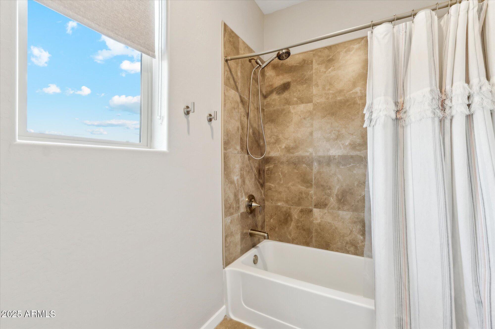 27420 North 170th Street Rio Verde, AZ 85263 - Photo 14 of 39 a bathroom with a bathtub and a shower