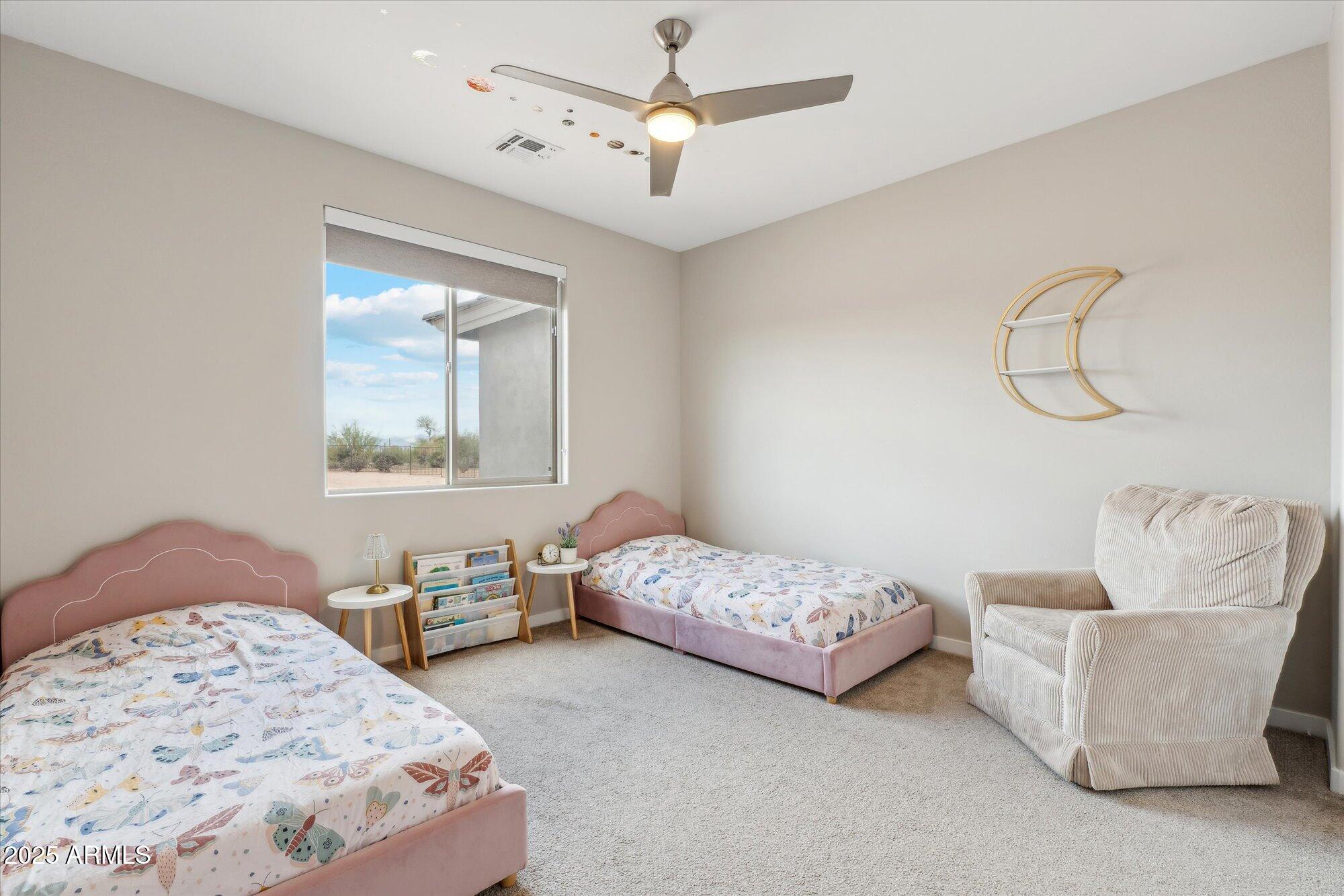 27420 North 170th Street Rio Verde, AZ 85263 - Photo 19 of 39 a bedroom with a bed couches and window