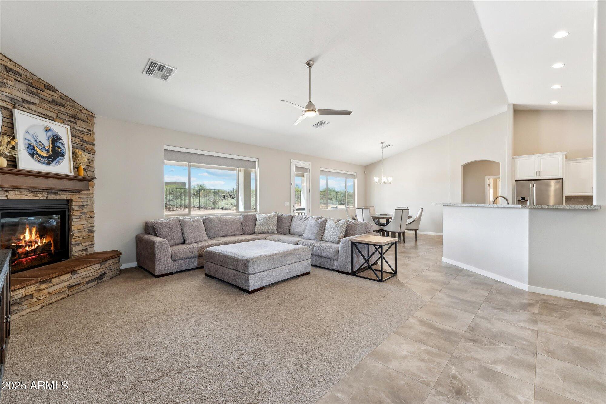 27420 North 170th Street Rio Verde, AZ 85263 - Photo 6 of 39 a living room with furniture and a fireplace